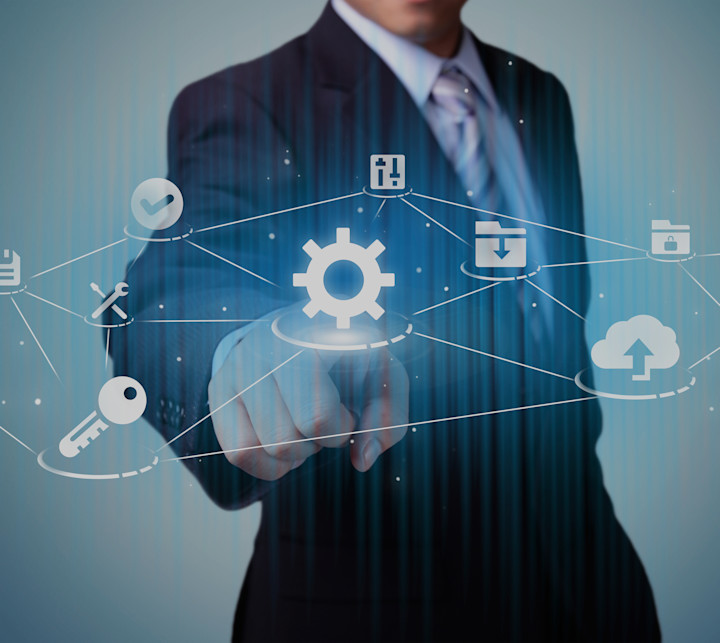 business man pointing at data thumbnails