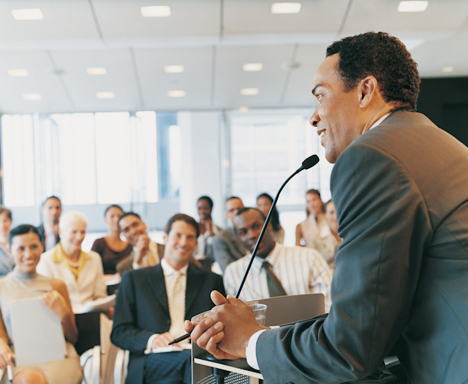 man-presenting-crowd-conference