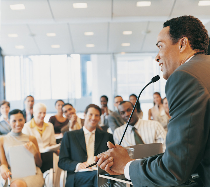 man-presenting-crowd-conference