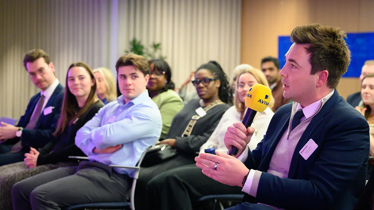 A speaker asks a question to our OpenSpace panelists