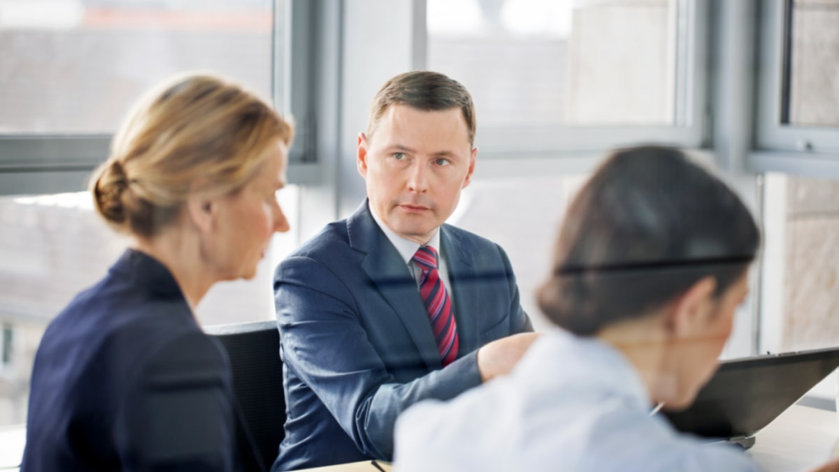 Man smiling at phone while using BoardWorks