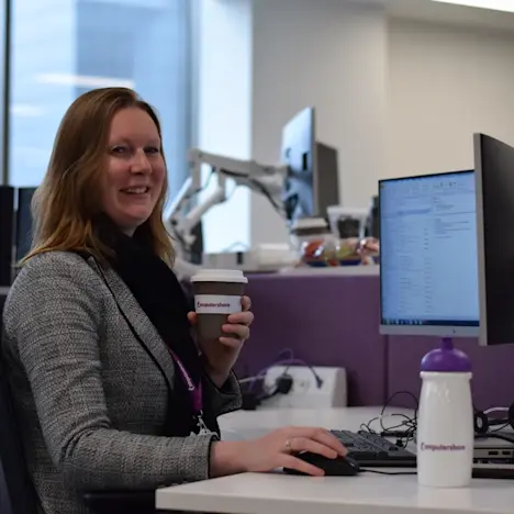 Employee sat in the office Tile image of Employee sat in the office