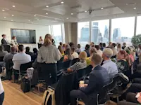 Thumbnail of The audience listen to the key speakers