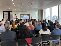 Thumbnail of The audience listens on to Computershare’s key speakers