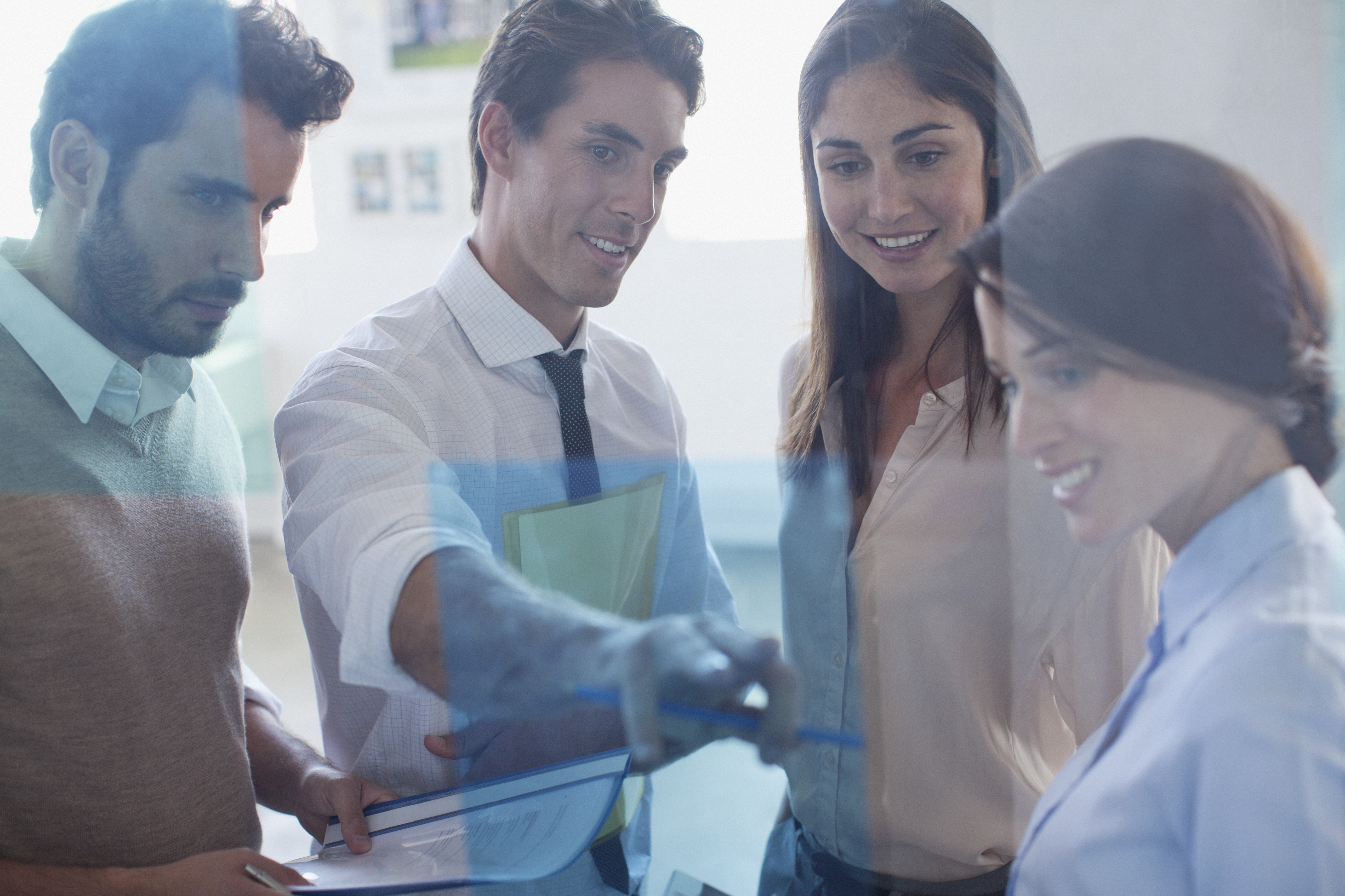 Smiling business people working together in office
