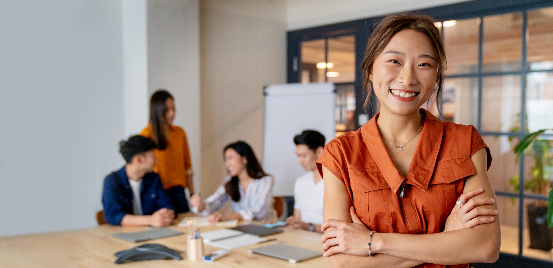 iStock-1141734069-HK-woman-crossed-arms-smiling