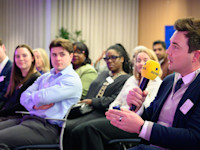 A speaker asks a question to our OpenSpace panelists Thumbnail of A speaker asks a question to our OpenSpace panelists