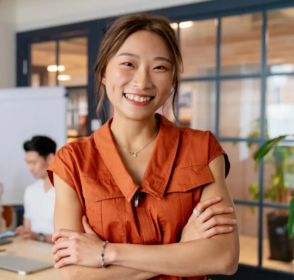 iStock-1141734069-HK-woman-crossed-arms-smiling-980x930