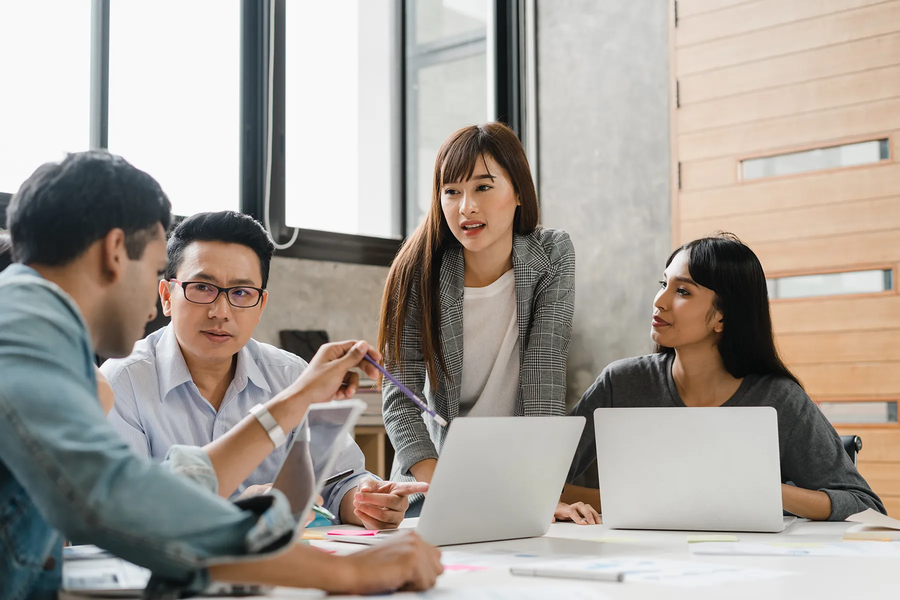 AdobeStock 473276830-Group-of-employees-discussing