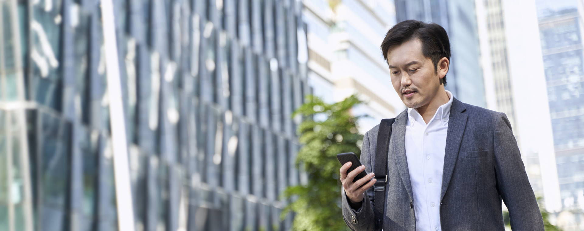 GettyImages-1332429837 Hero Image Man Using Phone HK China