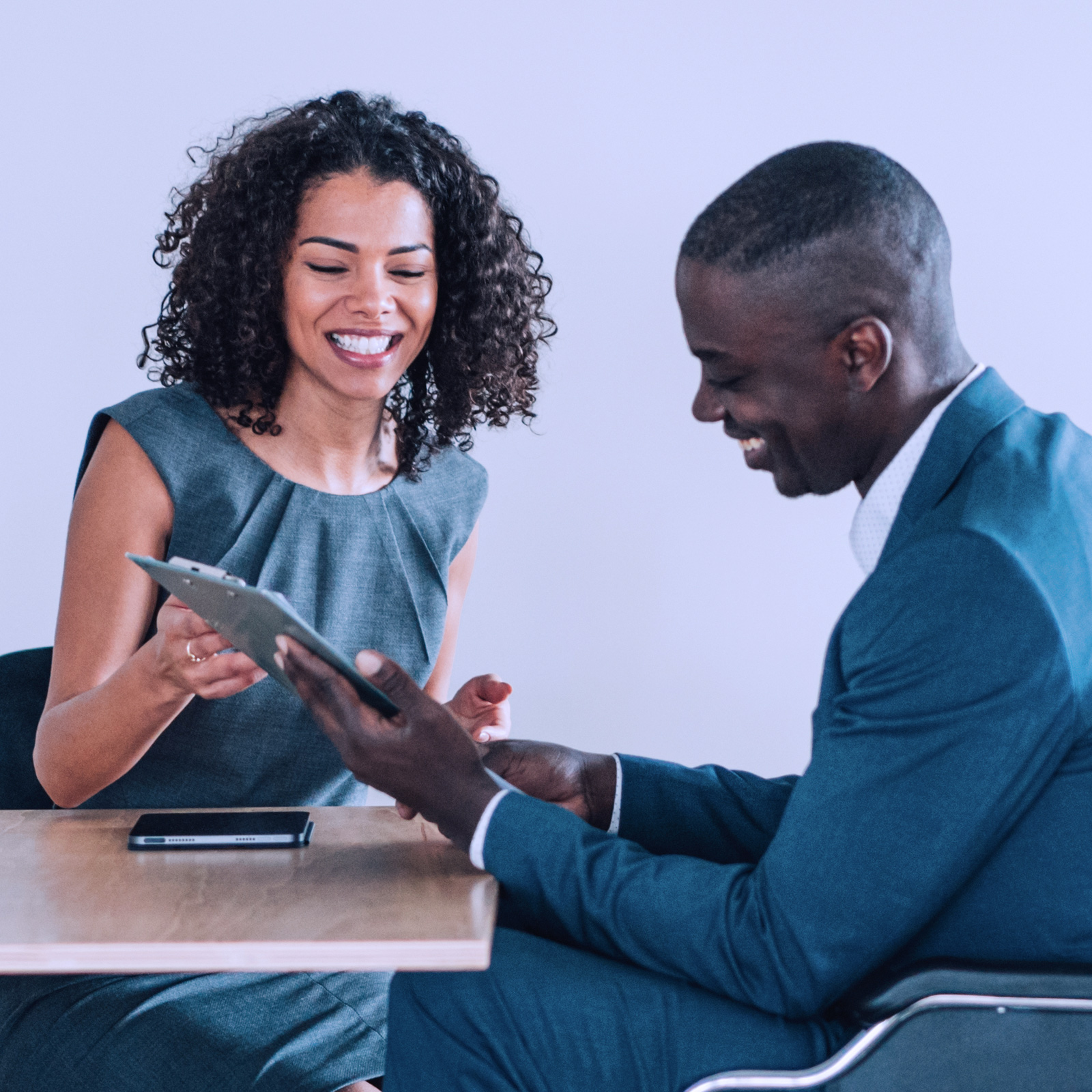 GettyImages-1360391593-Woman-and-man-on-wheelchair-looking-at-tablet-1600x1600