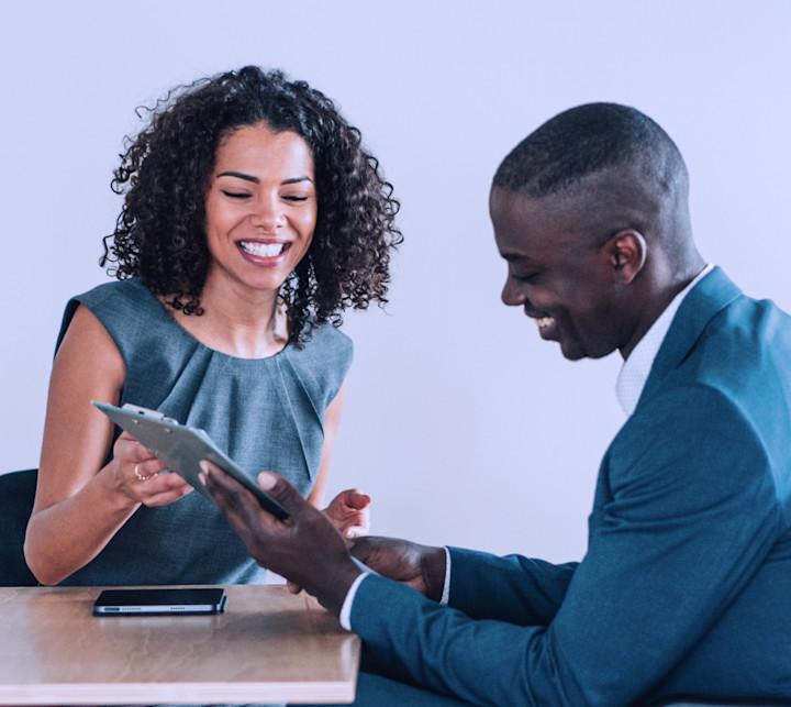 GettyImages-1360391593-Woman-and-man-on-wheelchair-looking-at-tablet-1600x1600