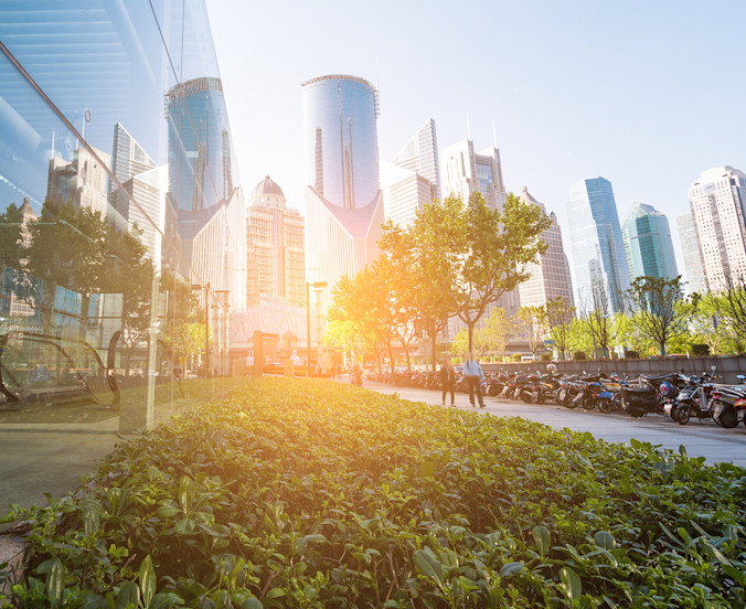 iStock-835385058 sunrise office buildings garden green sunlight-1800x1470