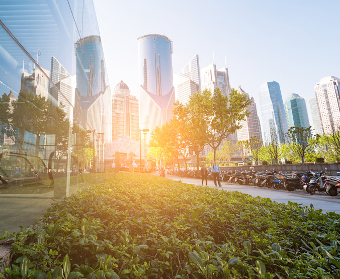iStock-835385058 sunrise office buildings garden green sunlight-1800x1470