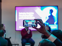 Someone takes a photo of the Industry Insights stage Thumbnail of Someone takes a photo of the Industry Insights stage