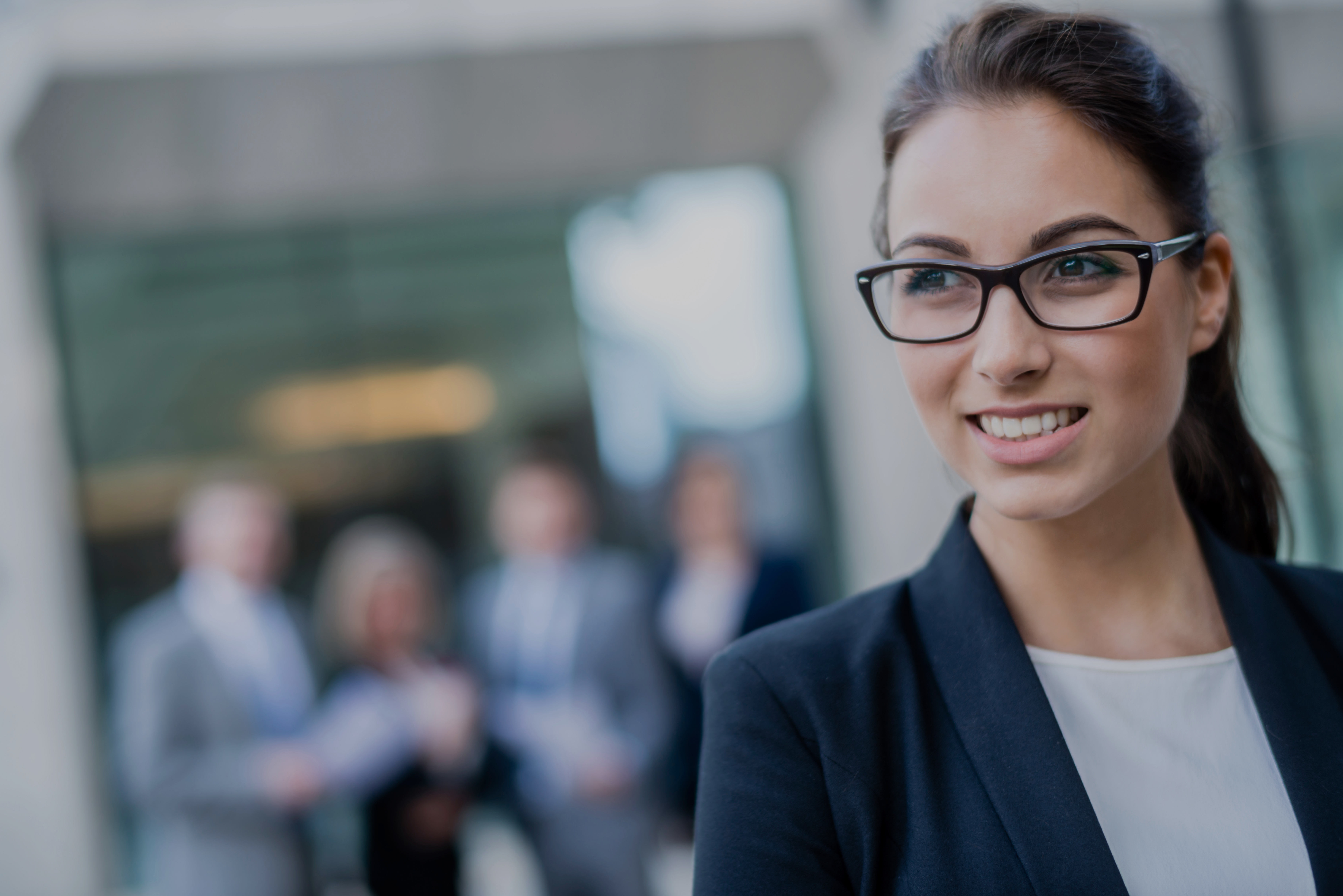 Smiling business woman in foreground