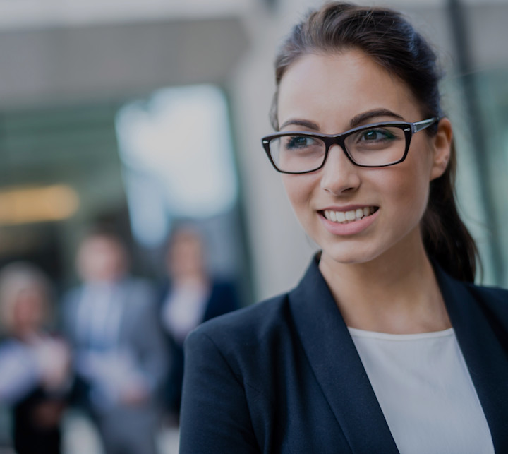 smiling business woman in foreground