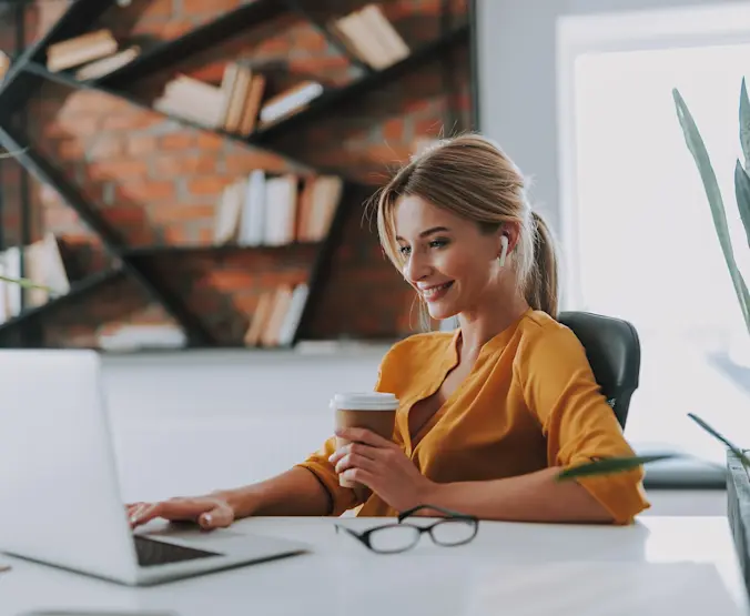lady in yellow shirt at laptop