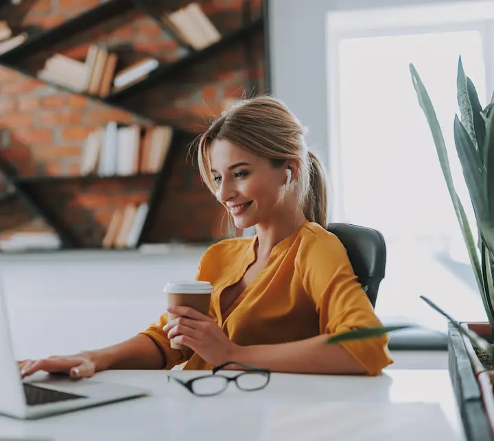 lady in yellow shirt at laptop