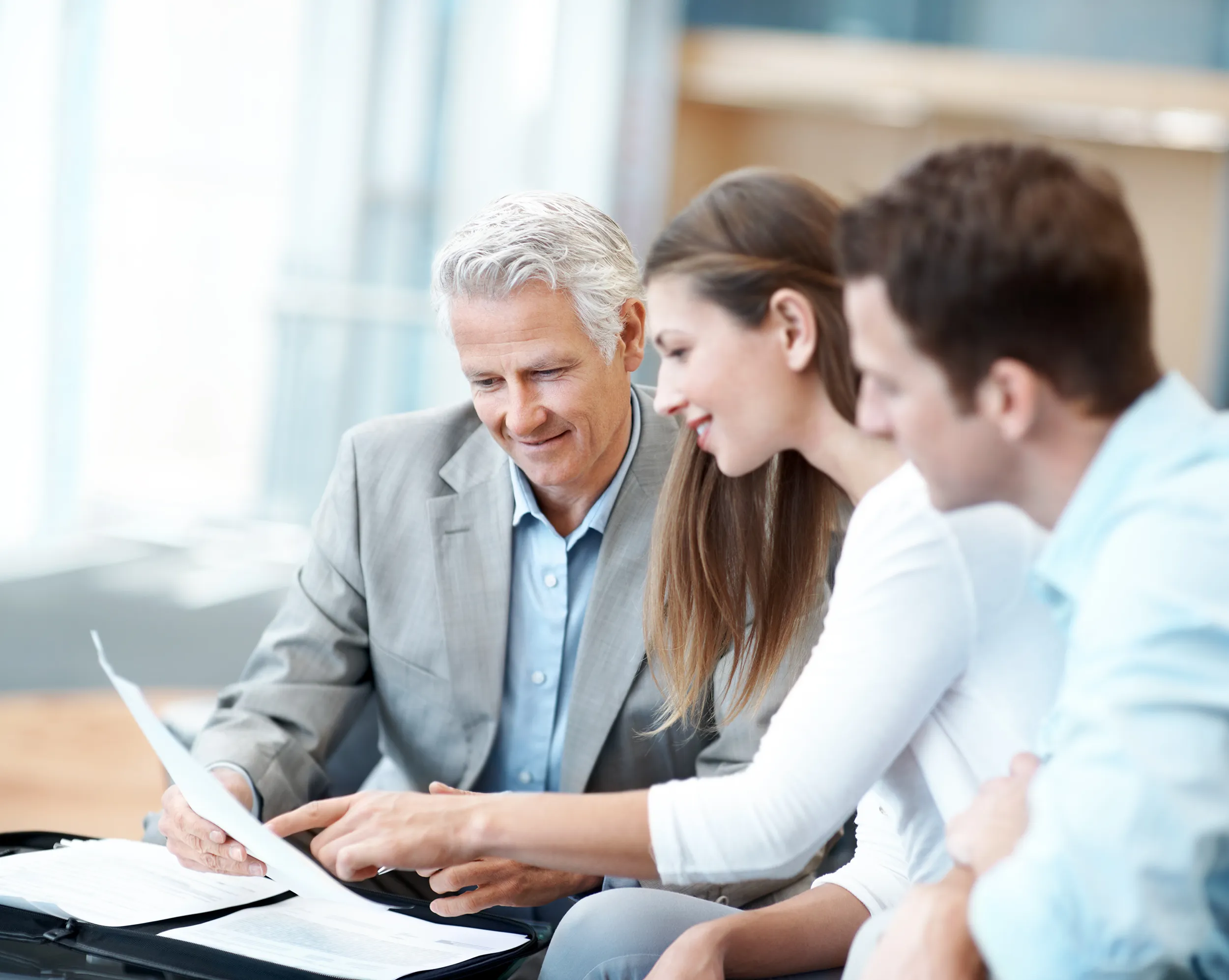 A team of business professionals reviewing a document