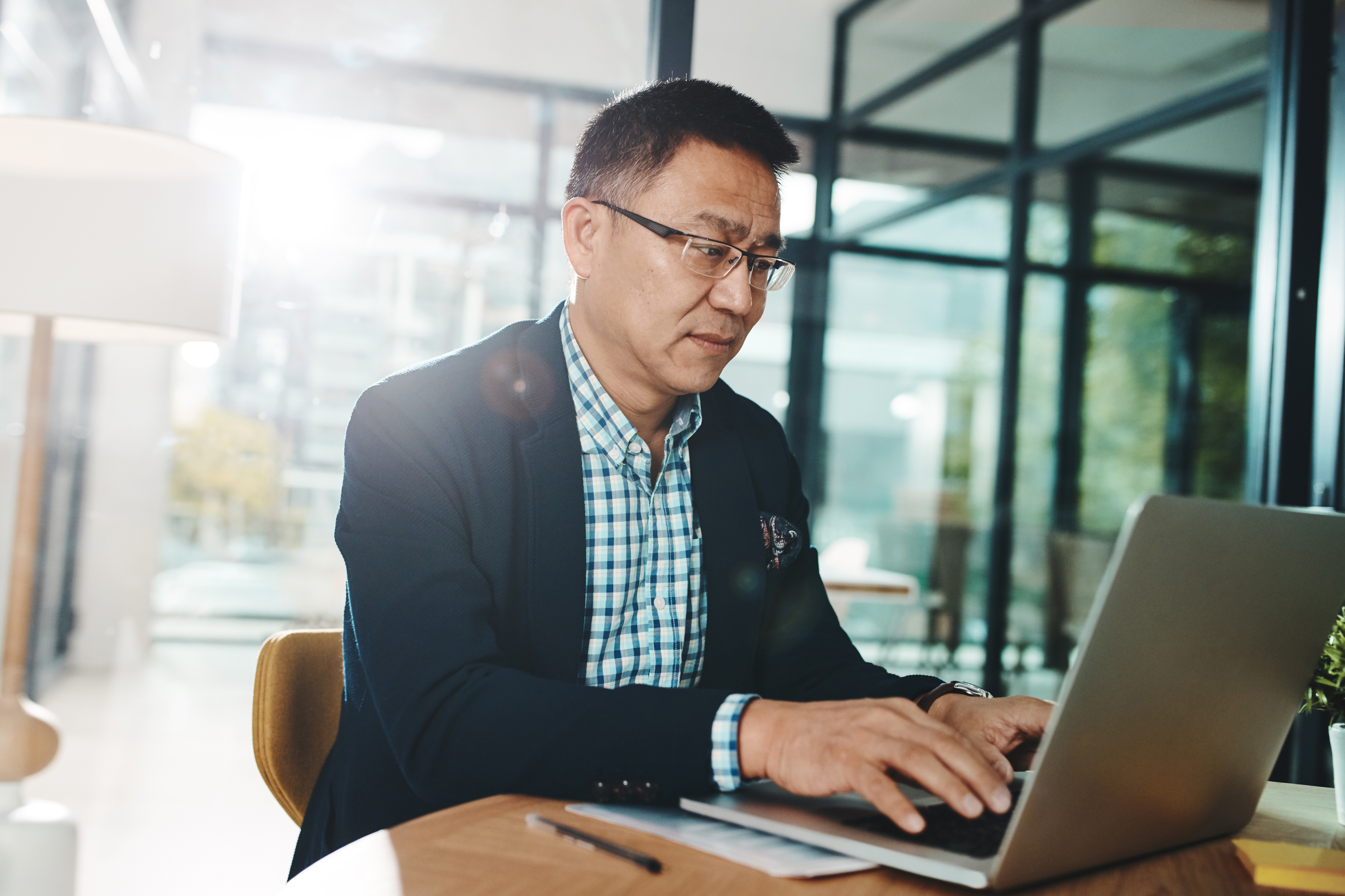 asian businessman on laptop