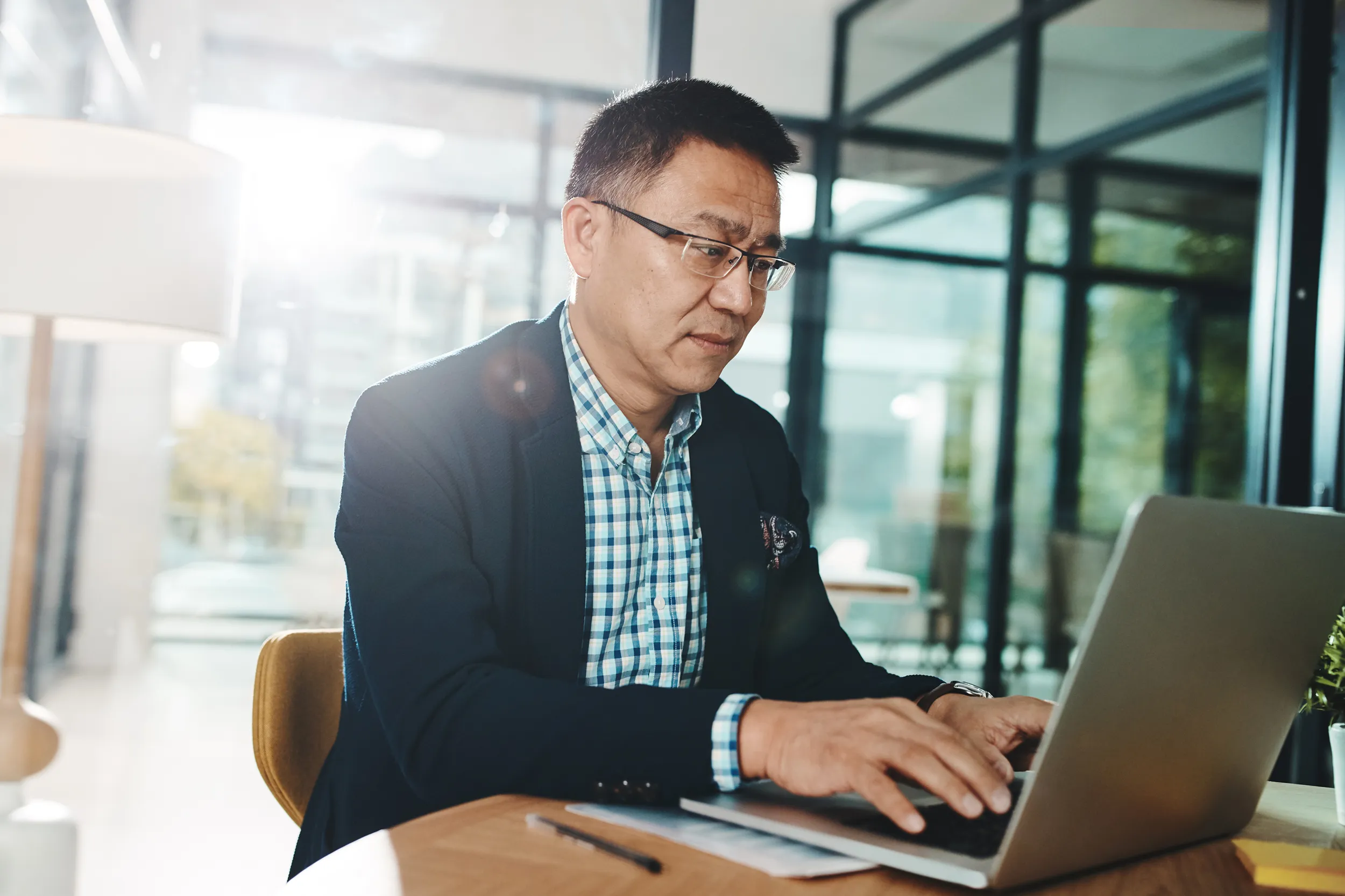 asian businessman on laptop