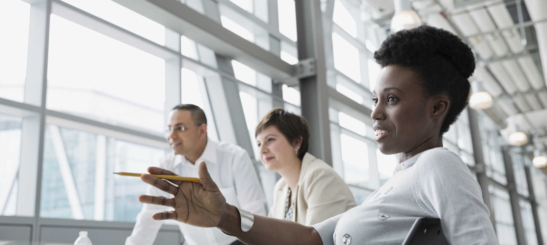 Businesswoman sharing insights with colleagues