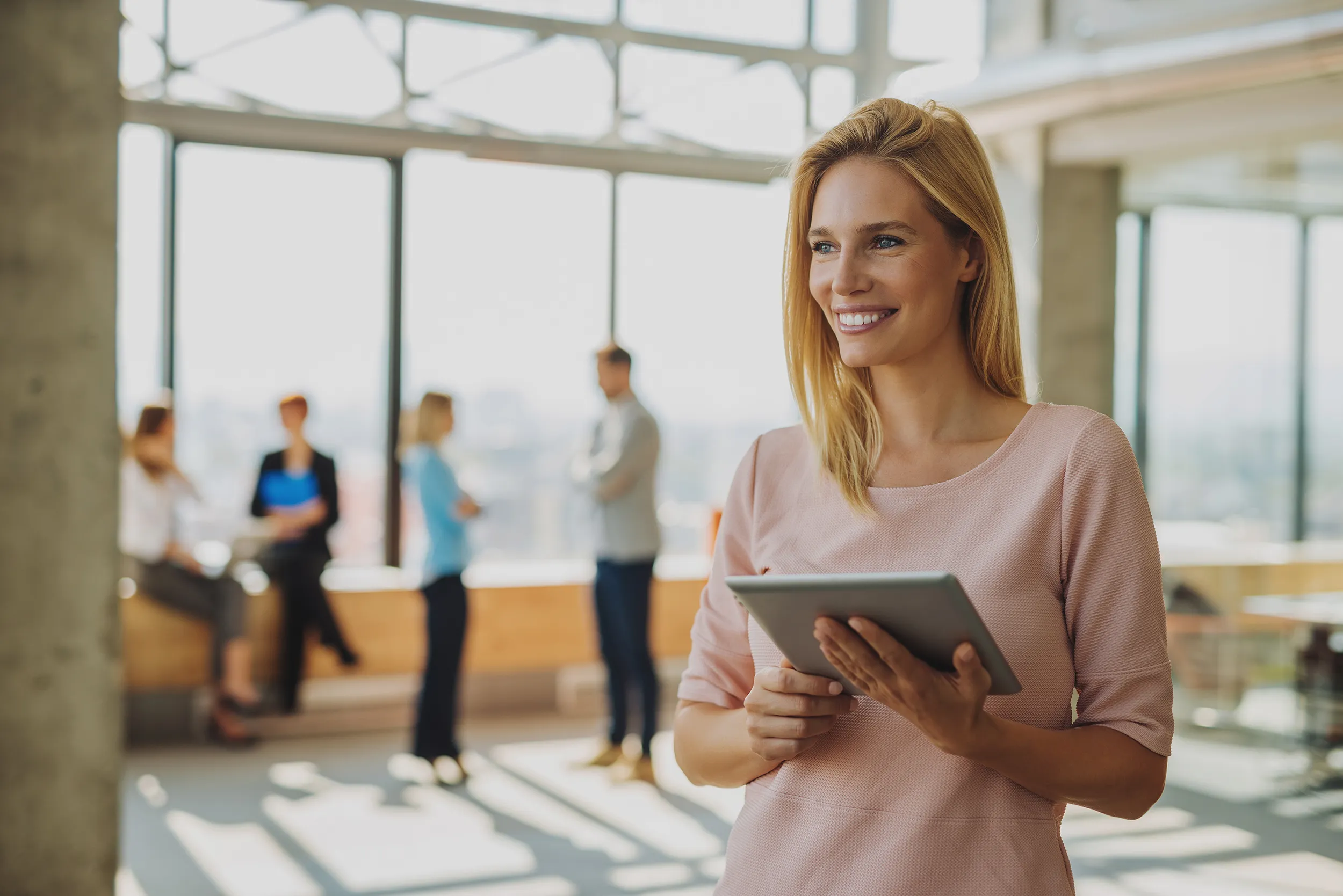 woman pink shirt tablet