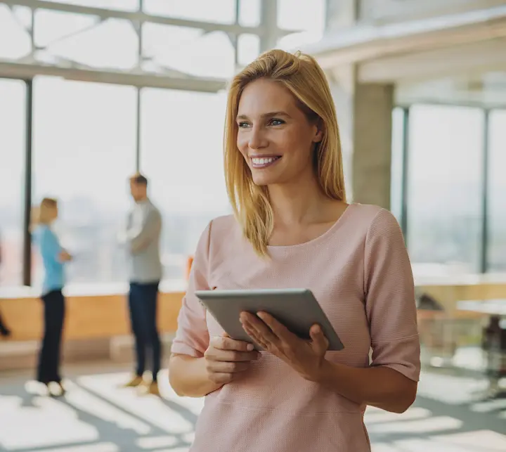 woman pink shirt tablet