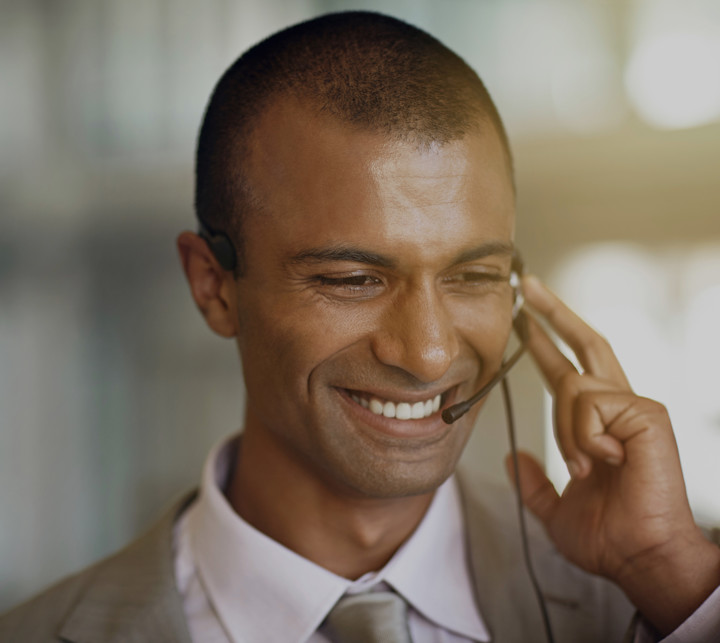 smiling man on headset
