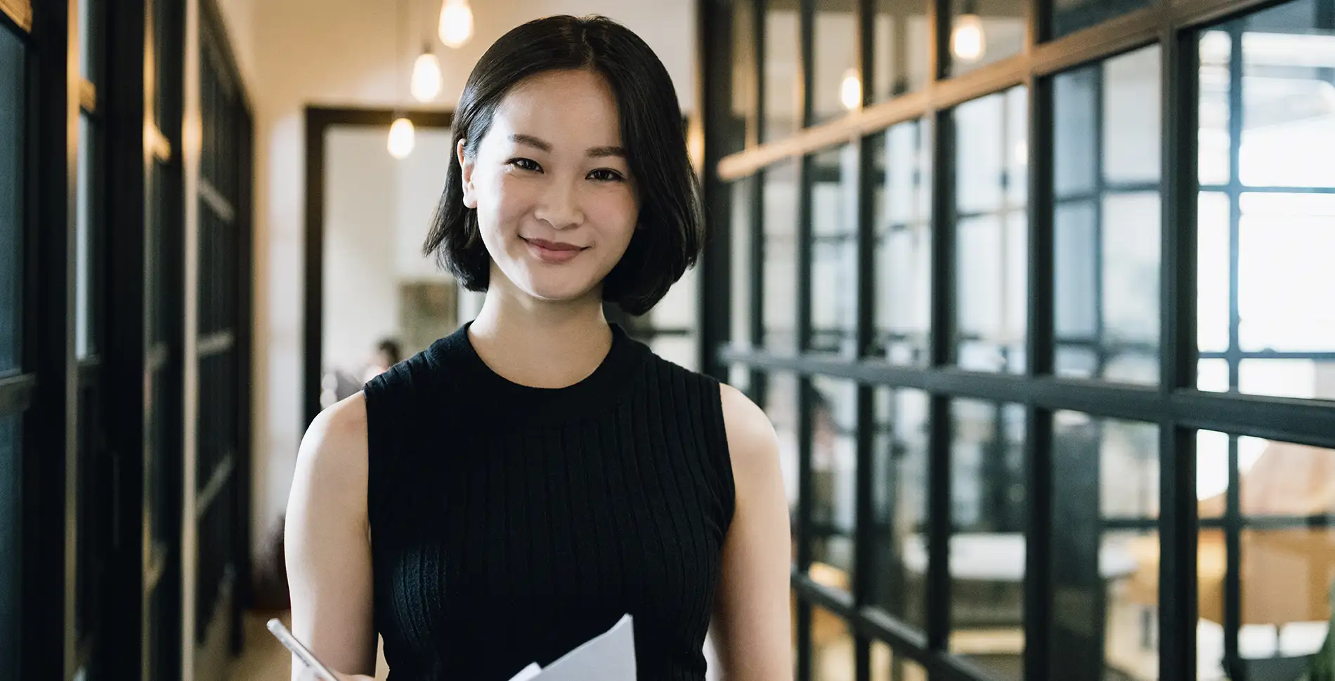 iStock-1222731173 asian female smiling paperwork office