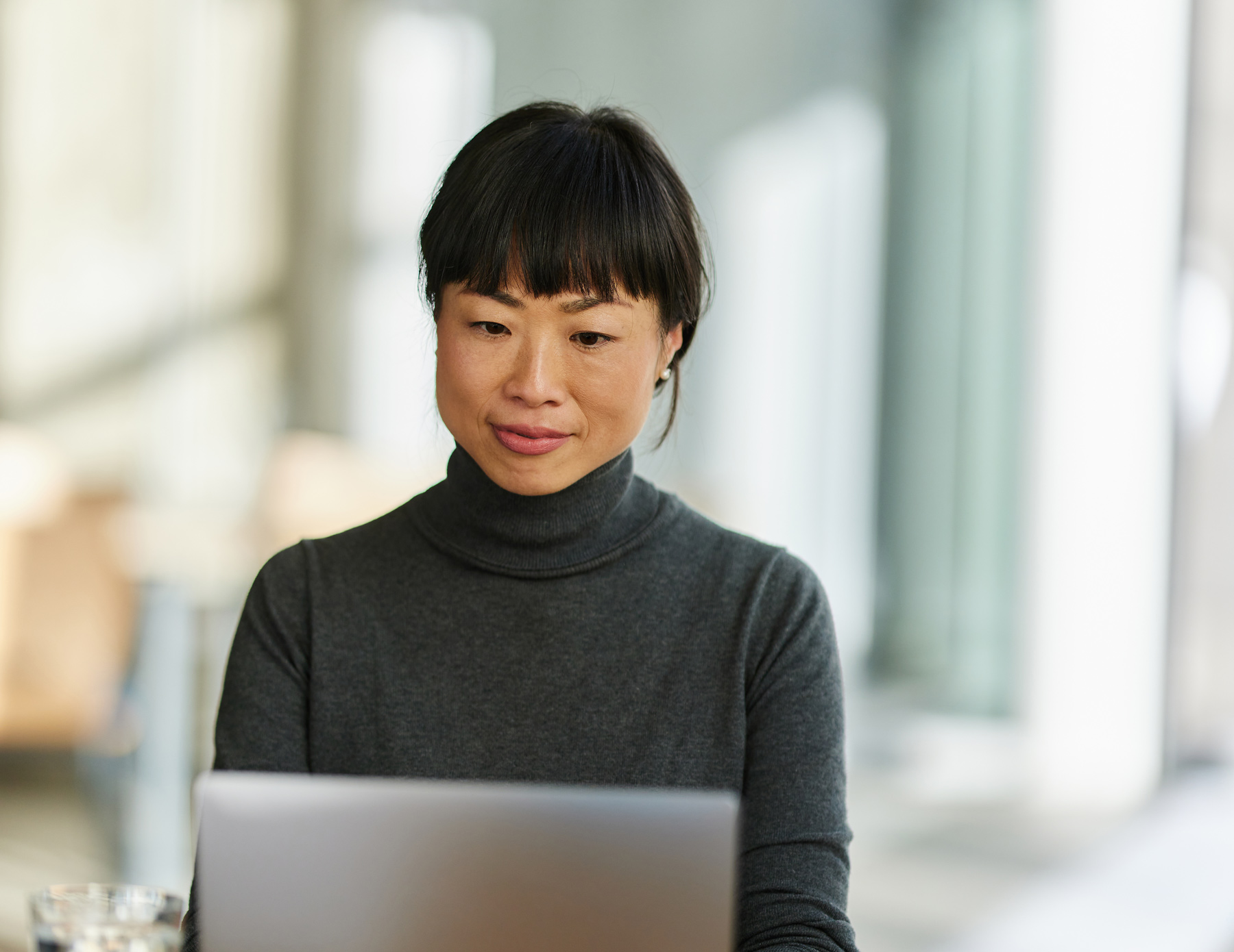 GettyImages-1824281827-woman-using-applications-on-laptop